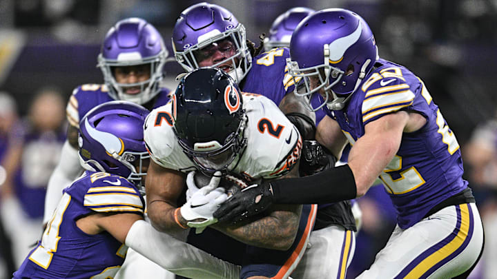 Chicago Bears wide receiver DJ Moore (2) is tackled by Minnesota Vikings safeties Harrison Smith, right, Cam Bynum, left, and Josh Metellus during the fourth quarter at U.S. Bank Stadium in Minneapolis on Nov. 27, 2023. Chicago Bears wide receiver DJ Moore (2) is tackled by Minnesota Vikings safeties Harrison Smith, right, Cam Bynum, left, and Josh Metellus during the fourth quarter at U.S. Bank Stadium in Minneapolis on Nov. 27, 2023.