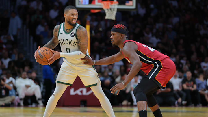 Nov 26, 2024; Miami, Florida, USA; Milwaukee Bucks guard Damian Lillard (0) protects the basketball from Miami Heat forward Jimmy Butler (22) during the third quarter at Kaseya Center. Mandatory Credit: Sam Navarro-Imagn Images Nov 26, 2024; Miami, Florida, USA; Milwaukee Bucks guard Damian Lillard (0) protects the basketball from Miami Heat forward Jimmy Butler (22) during the third quarter at Kaseya Center. Mandatory Credit: Sam Navarro-Imagn Images