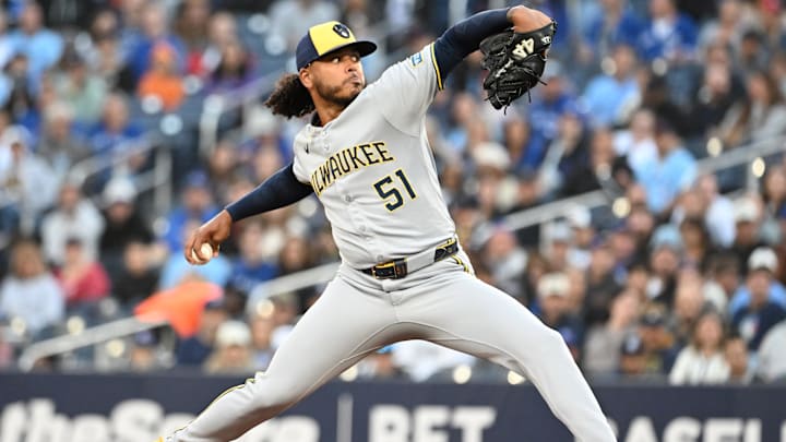 Aug 29, 2025; Toronto, Ontario, CAN;  Milwaukee Brewers starting pitcher Freddy Peralta (51) delivers a pitch against the Toronto Blue Jays in the first inning at Rogers Centre. Mandatory Credit: Dan Hamilton-Imagn Images