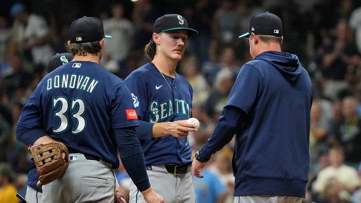 Aug 18, 2026; Milwaukee, Wisconsin, USA; Seattle Mariners pitcher Bryce Miller (50) is taken out of the game by Seattle Mariners designated hitter Dominic Canzone (8) in the fifth inning against the Milwaukee Brewers at American Family Field. Mandatory Credit: Michael McLoone-Imagn Images