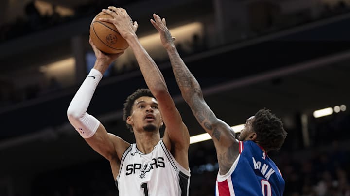 December 1, 2024; Sacramento, California, USA; San Antonio Spurs center Victor Wembanyama (1) shoots the basketball against Sacramento Kings guard Malik Monk (0) during the third quarter at Golden 1 Center. Mandatory Credit: Kyle Terada-Imagn Images