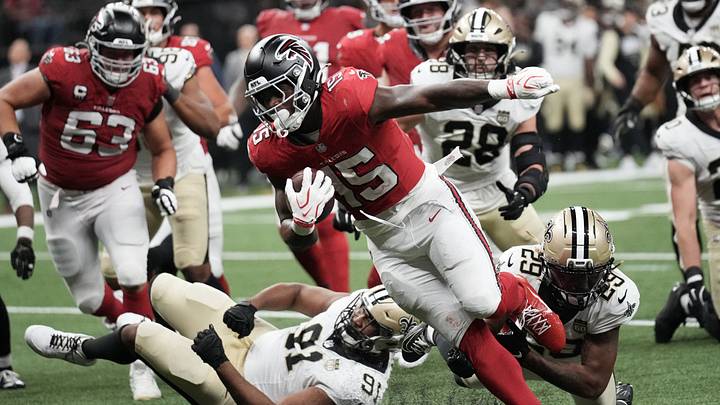 Oct 5, 2026; New Orleans, Louisiana, USA;  Atlanta Falcons running back Brian Robinson (15) runs to score a touchdown against New Orleans Saints defensive line Vernon Broughton (91) and cornerback Quincy Riley (29) in the during the second half at Caesars Superdome.  Mandatory Credit: Matthew Hinton-Imagn Images