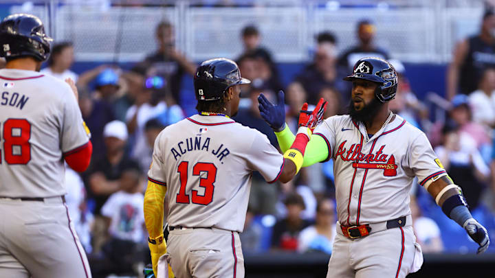 Apr 14, 2024; Miami, Florida, USA; Atlanta Braves designated hitter Marcell Ozuna (20) celebrates with right fielder Ronald Acuna Jr. (13) after hitting a two-run home run against the Miami Marlins during the ninth inning at loanDepot Park. Mandatory Credit: Sam Navarro-Imagn Images