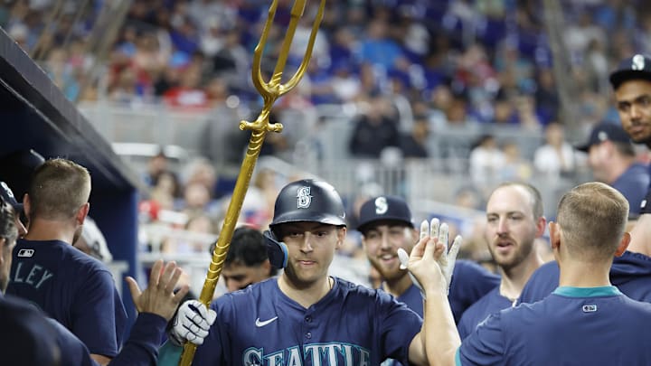 Seattle Mariners right fielder Dominic Canzone (8) celebrates after hitting a solo home run against the Miami Marlins in the fifth inning at loanDepot Park in 2024.