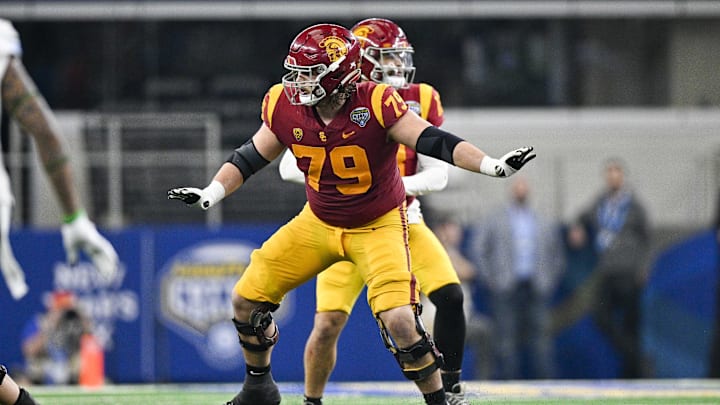 Jan 2, 2023; Arlington, Texas, USA; USC Trojans offensive lineman Jonah Monheim (79) in action during the game between the USC Trojans and the Tulane Green Wave in the 2023 Cotton Bowl at AT&T Stadium. Mandatory Credit: Jerome Miron-Imagn Images