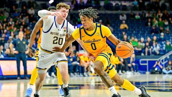 Mar 8, 2025; South Bend, Indiana, USA; Cal Bears guard Jeremiah Wilkinson (0) drives to the basket as Notre Dame Fighting Irish guard J.R. Konieczny (20) defends in the first half at the Purcell Pavilion. Mandatory Credit: Matt Cashore-Imagn Images