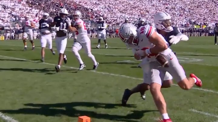 Ohio State quarterback Will Howard attempts to run into the end zone as Penn State safety Zakee Wheatley punches the ball out during the second quarter of Saturday's game at Beaver Stadium. 