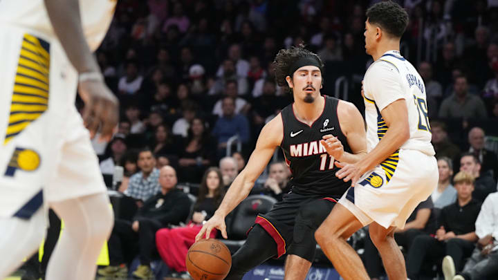 Jan 2, 2025; Miami, Florida, USA;  Miami Heat guard Jaime Jaquez Jr. (11) drives to the basket as Indiana Pacers guard Ben Sheppard (26) defends during the second half at Kaseya Center. Mandatory Credit: Jim Rassol-Imagn Images