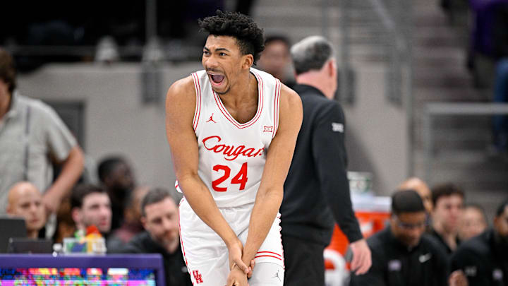 Jan 28, 2026; Fort Worth, Texas, USA; Houston Cougars forward Chase McCarty (24) yells to the bench as he grabs his wrist during the first half against the TCU Horned Frogs at Ed and Rae Schollmaier Arena. Mandatory Credit: Jerome Miron-Imagn Images