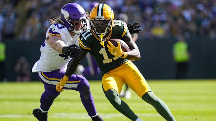 Sep 29, 2024; Green Bay, Wisconsin, USA; Green Bay Packers wide receiver Jayden Reed (11) rushes with the football after catching a pass as Minnesota Vikings outside linebacker Andrew Van Ginkel (43) reaches out during the third quarter at Lambeau Field. Mandatory Credit: Jeff Hanisch-Imagn Images Sep 29, 2024; Green Bay, Wisconsin, USA; Green Bay Packers wide receiver Jayden Reed (11) rushes with the football after catching a pass as Minnesota Vikings outside linebacker Andrew Van Ginkel (43) reaches out during the third quarter at Lambeau Field. Mandatory Credit: Jeff Hanisch-Imagn Images