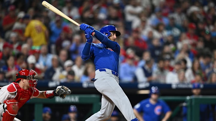 Sep 25, 2024; Philadelphia, Pennsylvania, USA; Chicago Cubs infielder Cody Bellinger (24) hits an RBI single against the Philadelphia Phillies in the fifth inning at Citizens Bank Park. 