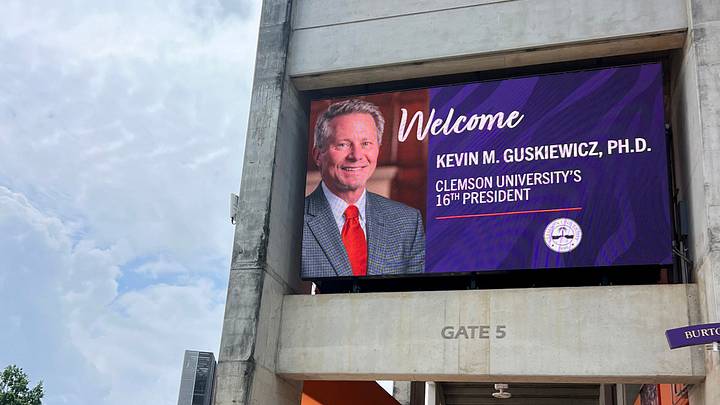 A video screen at Memorial Stadium welcoming Kevin Guskiewicz, Michigan State University President as the 16th President in Clemson, South Carolina Wednesday, May 27, 2026. A video screen at Memorial Stadium welcoming Kevin Guskiewicz, Michigan State University President as the 16th President in Clemson, South Carolina Wednesday, May 27, 2026.
