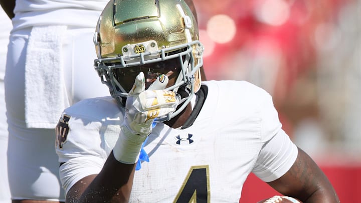 Notre Dame Fighting Irish running back Jeremiyah Love (4) signals first down after a run in the first quarter against the Arkansas Razorbacks at Razorback Stadium. Notre Dame Fighting Irish running back Jeremiyah Love (4) signals first down after a run in the first quarter against the Arkansas Razorbacks at Razorback Stadium.