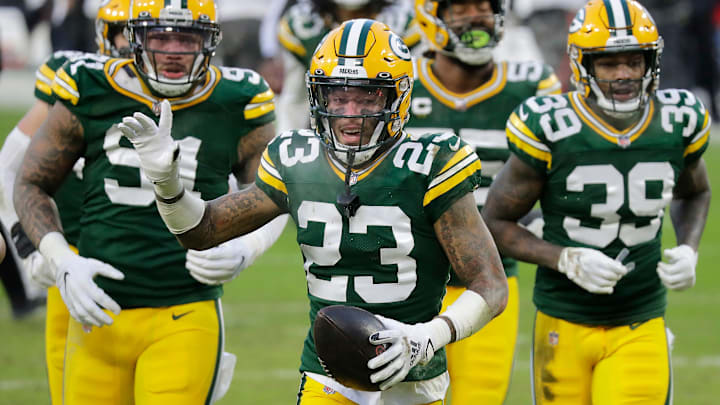 Green Bay Packers cornerback Jaire Alexander (23) celebrates a fourth-quarter interception against the Tampa Bay Buccaneers during the NFC Championship game on Sunday, January 24, 2021, at Lambeau Field in Green Bay, Wis.