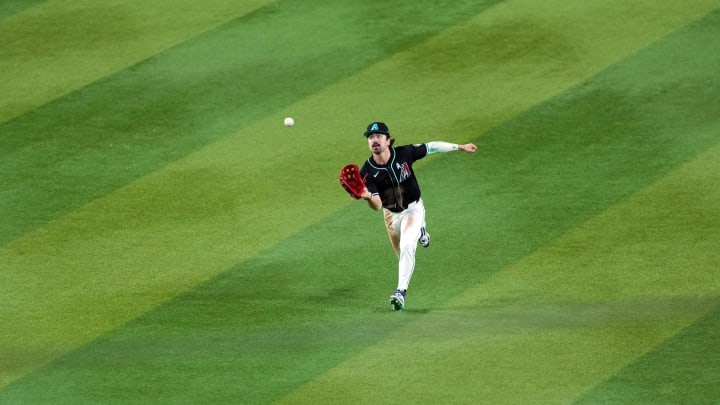 Jun 16, 2024; Phoenix, Arizona, USA; Arizona Diamondbacks outfielder Corbin Carroll (7) runs down a fly ball against the Chicago White Sox during the seventh inning at Chase Field. Mandatory Credit: Joe Camporeale-USA TODAY Sports