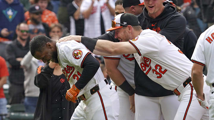 Apr 17, 2024; Baltimore, Maryland, USA; Baltimore Orioles outfielder Cedric Mullins (21) greeted by teammates.