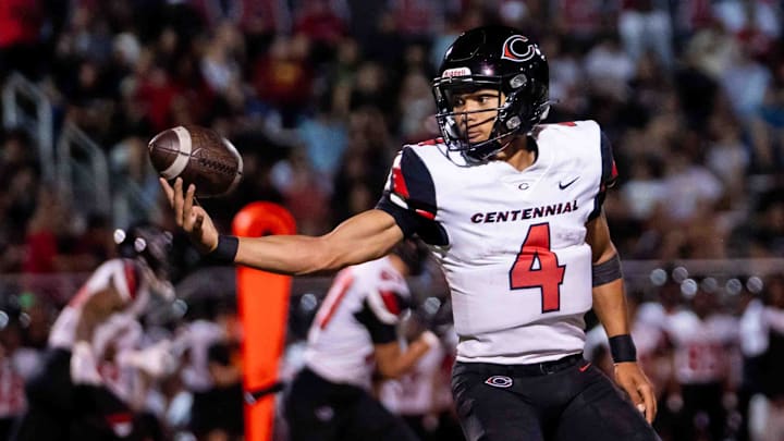 Centennial Huskies Quarterback Husan Longstreet (4) catches the ball at Liberty High School on Sept. 21, 2024, in Peoria.