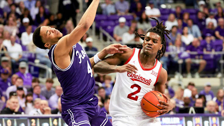 Feb 24, 2024; Fort Worth, Texas, USA; Cincinnati Bearcats guard Jizzle James (2) drives to the basket as TCU Horned Frogs guard Jameer Nelson Jr. (4) defends during the second half at Ed and Rae Schollmaier Arena. Mandatory Credit: Kevin Jairaj-Imagn Images Feb 24, 2024; Fort Worth, Texas, USA; Cincinnati Bearcats guard Jizzle James (2) drives to the basket as TCU Horned Frogs guard Jameer Nelson Jr. (4) defends during the second half at Ed and Rae Schollmaier Arena. Mandatory Credit: Kevin Jairaj-Imagn Images