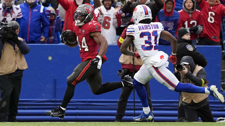 Tampa Bay Buccaneers' running back Sean Tucker (44) and Buffalo Bills cornerback Maxwell Hairston (31).