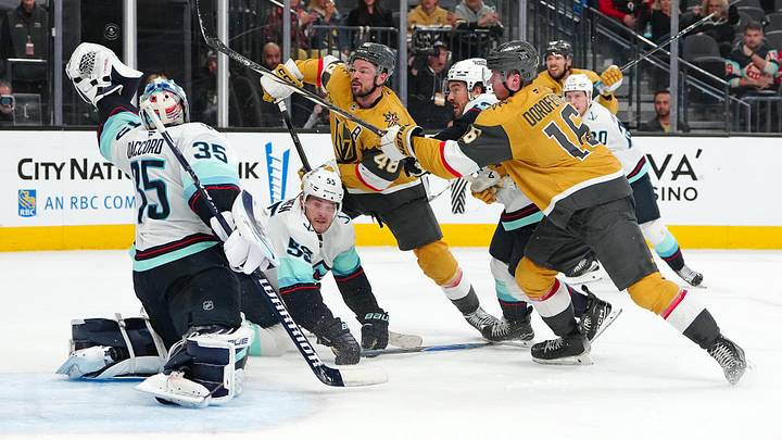 Jan 31, 2026; Las Vegas, Nevada, USA; Seattle Kraken goaltender Joey Daccord (35) looks to glove a loose puck as Vegas Golden Knights center Tomas Hertl (48) and right wing Pavel Dorofeyev (16) look for a rebound during the final seconds of the third period at T-Mobile Arena. Mandatory Credit: Stephen R. Sylvanie-Imagn Images