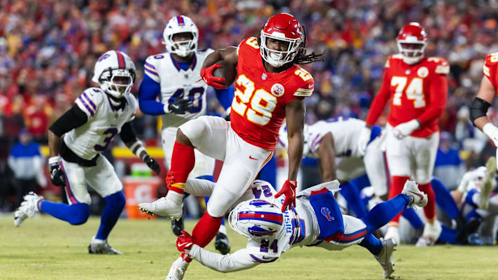 Jan 26, 2025; Kansas City, MO, USA; Kansas City Chiefs running back Kareem Hunt (29) is tackled by Buffalo Bills safety Cole Bishop (24) in the AFC Championship game at GEHA Field at Arrowhead Stadium. Mandatory Credit: Mark J. Rebilas-Imagn Images