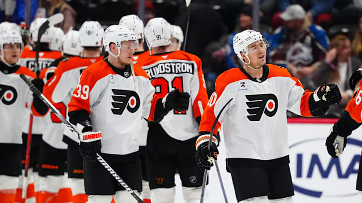 Jan 23, 2026; Denver, Colorado, USA; Members of the Philadelphia Flyers celebrate defeating the Colorado Avalanche at Ball Arena. Mandatory Credit: Ron Chenoy-Imagn Images