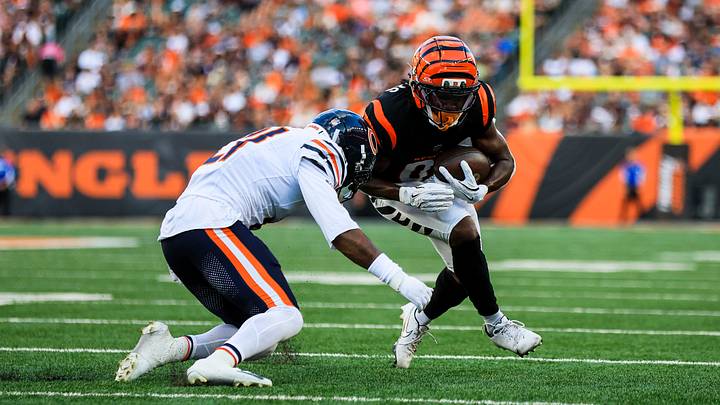 Cam Lewis of the Bears tries to tackle Bengals receiver Dohnte Meyers. Lewis got a start ahead of Xavier Woods on Saturday.