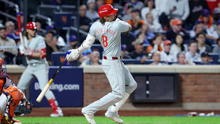 Oct 8, 2024; New York City, New York, USA; Philadelphia Phillies outfielder Nick Castellanos (8) hits an RBI single in the eighth inning against the New York Mets during game three of the NLDS for the 2024 MLB Playoffs at Citi Field.
