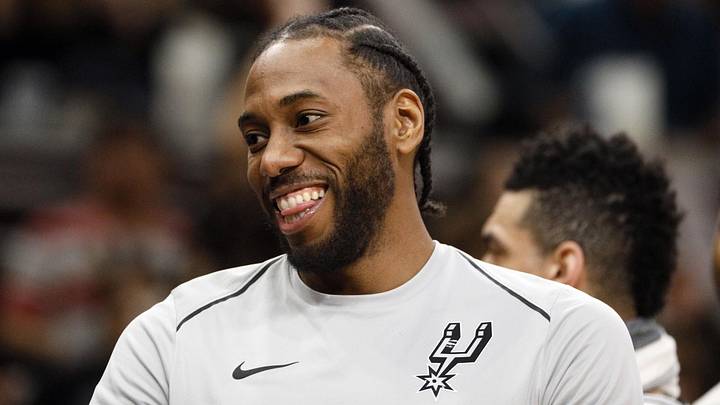 Mar 13, 2018; San Antonio, TX, USA; San Antonio Spurs small forward Kawhi Leonard (2) smiles during a timeout against the Orlando Magic at AT&T Center. Mandatory Credit: Soobum Im-Imagn Images