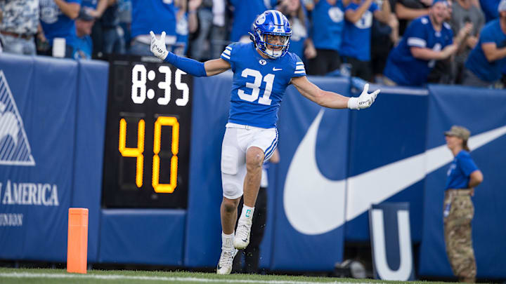 Max Tooley celebrates a pick-six against Utah Stae