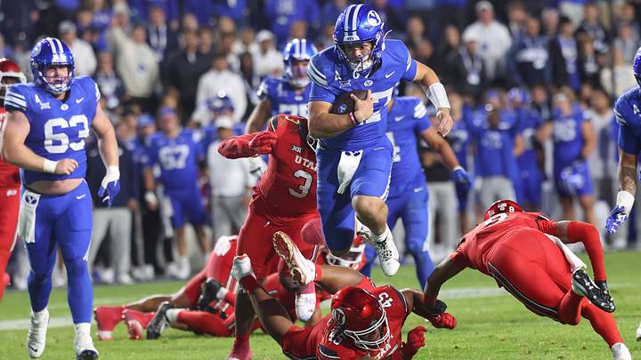 Oct 18, 2025; Provo, Utah, USA; BYU Cougars quarterback Bear Bachmeier (47) runs for a touchdown against Utah Utes defensive tackle Pupu Sepulona (45), cornerback Elijah Davis (9) and linebacker Levani Damuni (3) during the second half at LaVell Edwards Stadium. Mandatory Credit: Rob Gray-Imagn Images Oct 18, 2025; Provo, Utah, USA; BYU Cougars quarterback Bear Bachmeier (47) runs for a touchdown against Utah Utes defensive tackle Pupu Sepulona (45), cornerback Elijah Davis (9) and linebacker Levani Damuni (3) during the second half at LaVell Edwards Stadium. Mandatory Credit: Rob Gray-Imagn Images
