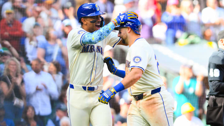 Seattle Mariners center fielder Julio Rodriguez (left) congratulates catcher Cal Raleigh after Raleigh hit a home run against the Oakland Athletics on Sept. 29 at T-Mobile Park. Seattle Mariners center fielder Julio Rodriguez (left) congratulates catcher Cal Raleigh after Raleigh hit a home run against the Oakland Athletics on Sept. 29 at T-Mobile Park.