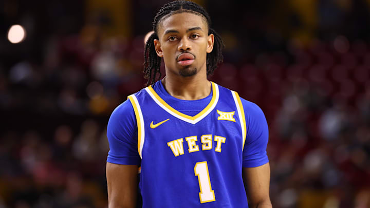 Jan 21, 2026; Tempe, Arizona, USA; West Virginia Mountaineers guard Jasper Floyd (1) against the Arizona State Sun Devils at Desert Financial Arena. Mandatory Credit: Mark J. Rebilas-Imagn Images
