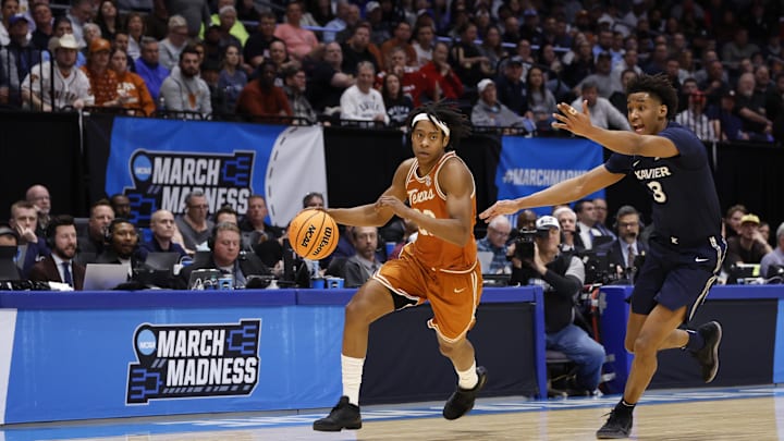 Mar 19, 2025; Dayton, OH, USA; Texas Longhorns guard Tre Johnson (20) dribbles pressured by Xavier Musketeers guard Dailyn Swain (3) in the first half at UD Arena. Mandatory Credit: Rick Osentoski-Imagn Images