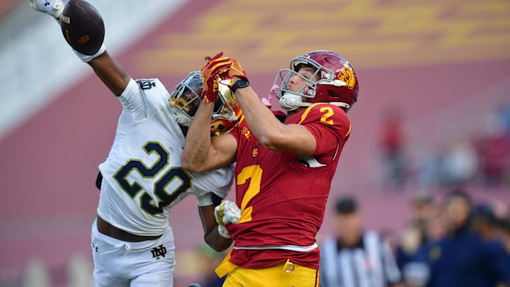 Nov 30, 2024; Los Angeles, California, USA; Notre Dame Fighting Irish cornerback Christian Gray (29) blocks a pass intended for Southern California Trojans wide receiver Duce Robinson (2) during the second half at the Los Angeles Memorial Coliseum. Mandatory Credit: Gary A. Vasquez-Imagn Images