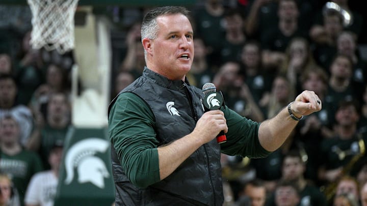 Dec 2, 2025; East Lansing, Michigan, USA;  Michigan State head football coach Pat Fitzgerald watches the Spartans defeat the Iowa Hawkeyes at Jack Breslin Student Events Center. Mandatory Credit: Dale Young-Imagn Images