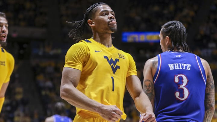 Jan 10, 2026; Morgantown, West Virginia, USA; West Virginia Mountaineers guard Jasper Floyd (1) celebrates during the second half against the Kansas Jayhawks at Hope Coliseum. Mandatory Credit: Ben Queen-Imagn Images