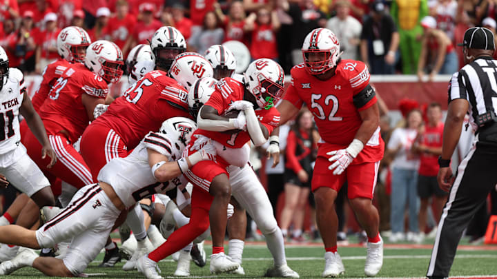Sep 20, 2025; Salt Lake City, Utah, USA; Utah Utes running back Wayshawn Parker (1) runs for a touchdown as Texas Tech Red Raiders linebacker John Curry (6) defends during the fourth quarter at Rice-Eccles Stadium. Mandatory Credit: Rob Gray-Imagn Images