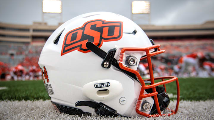 Aug 31, 2024; Stillwater, Oklahoma, USA; Oklahoma State Cowboys helmet sits on the field prior to the game against the South Dakota State Jackrabbits at Boone Pickens Stadium. Mandatory Credit: William Purnell-Imagn Images