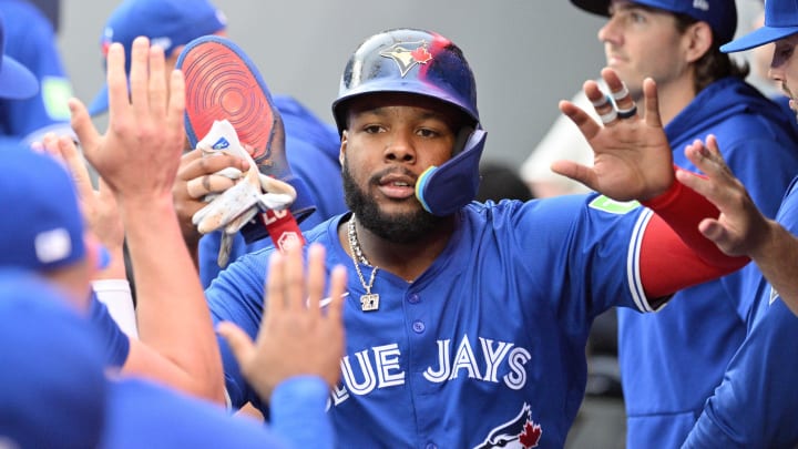 Jul 2, 2024; Toronto, Ontario, CAN; Toronto Blue Jays first baseman Vladimir Guerrero Jr. (27) celebrates in the dug out in the first inning the Houston Astros in the first inning at Rogers Centre. Mandatory Credit: Dan Hamilton-USA TODAY Sports