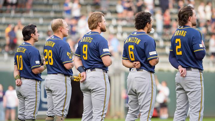 May 15, 2026; Minneapolis, Minnesota, USA; Milwaukee Brewers third baseman David Hamilton (6) blows a bubble ass players line up for the national anthem before the game against the Minnesota Twins line up for the national anthem before the game against the Minnesota Twins at Target Field. Mandatory Credit: Matt Blewett-Imagn Images May 15, 2026; Minneapolis, Minnesota, USA; Milwaukee Brewers third baseman David Hamilton (6) blows a bubble ass players line up for the national anthem before the game against the Minnesota Twins line up for the national anthem before the game against the Minnesota Twins at Target Field. Mandatory Credit: Matt Blewett-Imagn Images