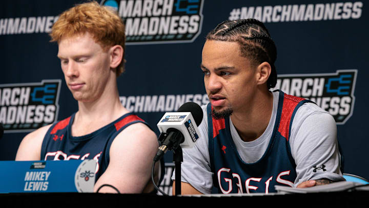Mar 18, 2026; Oklahoma City, OK, USA; Saint Mary's Gaels guard Joshua Dent (7) and Saint Mary's Gaels guard Mikey Lewis (0) give an interview prior to a practice session ahead of the first round of the men's 2026 NCAA Tournament at Paycom Center. Mandatory Credit: William Purnell-Imagn Images