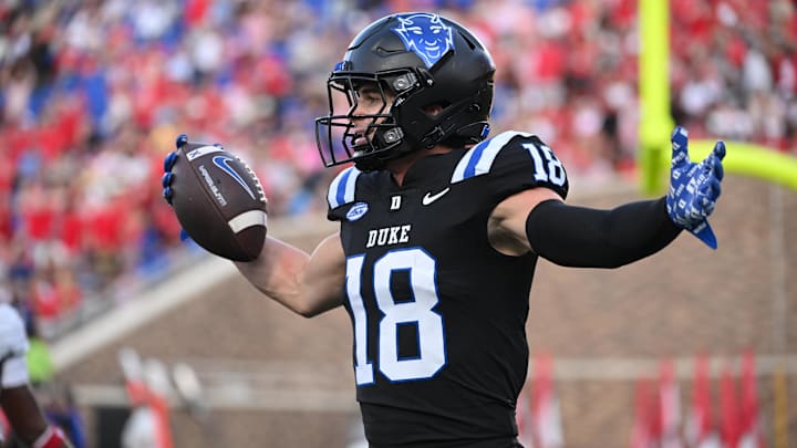 Sep 20, 2025; Durham, North Carolina, USA;  Duke Blue Devils wide receiver Cooper Barkate (18) celebrates a touchdown during the third quarter against the NC State Wolfpack at Wallace Wade Stadium. Mandatory Credit: Zachary Taft-Imagn Images