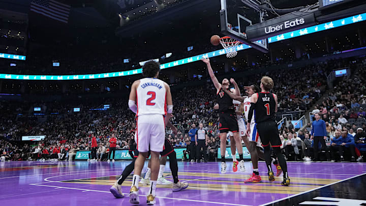 Nov 15, 2024; Toronto, Ontario, CAN; Toronto Raptors center Jakob Poeltl (19) battles for the rebound with Detroit Pistons center Jalen Duren (0) during the third quarter at Scotiabank Arena. Mandatory Credit: Nick Turchiaro-Imagn Images