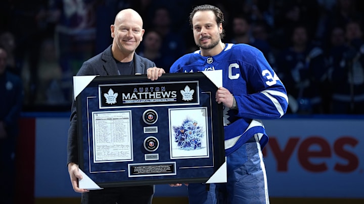Jan 6, 2026; Toronto, Ontario, CAN; Toronto Maple Leafs center Auston Matthews (34) is presented with a plaque for passing Mats Sundin as the all time leading scorer with 421 goals before a game against the Florida Panthers at Scotiabank Arena. Mandatory Credit: Nick Turchiaro-Imagn Images