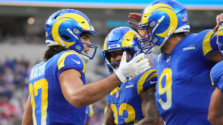 Dec 8, 2024; Inglewood, California, USA; Los Angeles Rams wide receiver Puka Nacua (17) celebrates with quarterback Matthew Stafford (9) and running back Kyren Williams (23) after scoring a touchdown run in the second quarter against the Buffalo Bills at SoFi Stadium. Mandatory Credit: Kirby Lee-Imagn Images