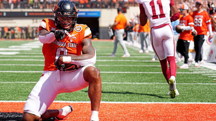 Oklahoma State's Ollie Gordon II (0) celebrates a 2-point conversion front of /tJaylon Braxton (11) in double overtime of the college football game between the Oklahoma State Cowboys and the Arkansas Razorbacks at Boone Pickens Stadium in Stillwater, Okla.,, Saturday, Sept., 7, 2024.