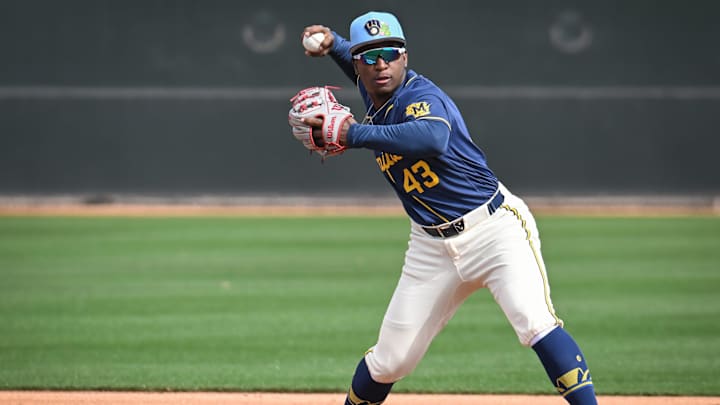 Milwaukee Brewers infield prospect Luis Pena throws to first in a double-play drill during spring training workouts Sunday, February 15, 2026, at American Family Fields of Phoenix in Phoenix, Arizona.