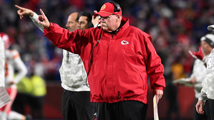 Kansas City Chiefs head coach Andy Reid signals to go for one point after a touchdown against the Buffalo Bills in the fourth quarter at Highmark Stadium.