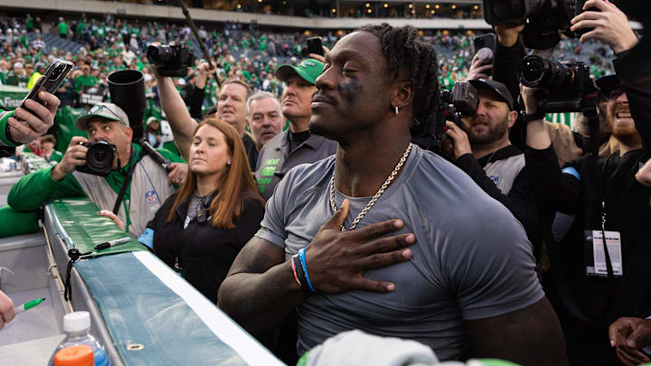 Philadelphia Eagles wide receiver A.J. Brown thanks a fan for returning the first NFL touchdown pass of quarterback Tanner McKee.